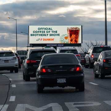 outfront billboard in philadelphia for dunkin featuring contextually relevant eagles creative