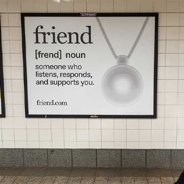 friend ai train banner in new york city out of home advertising transit interior cards